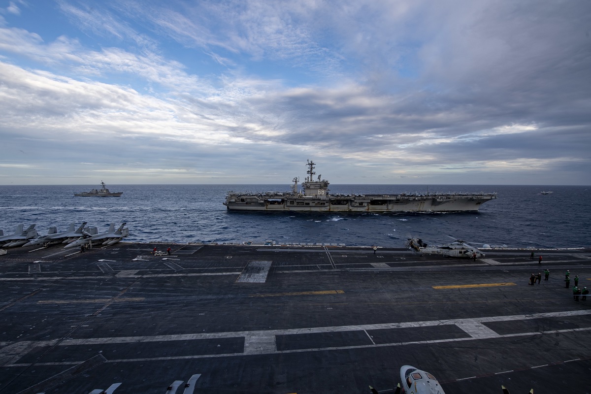 Two weeks after Chinese Combat aircraft conducted a mock attack on USS Theodore Roosevelt, the flattop conducts dual carrier operations with USS Nimitz in the South China Sea