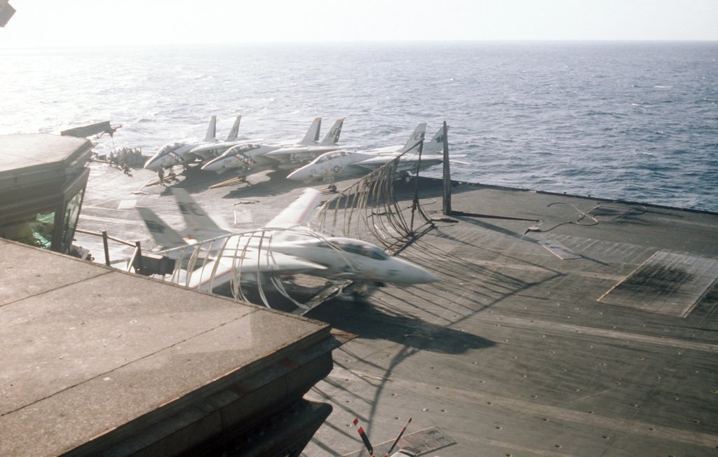 Photo Sequence shows F-14A Tomcat Engaging Barricade during Emergency Landing aboard USS Kitty Hawk