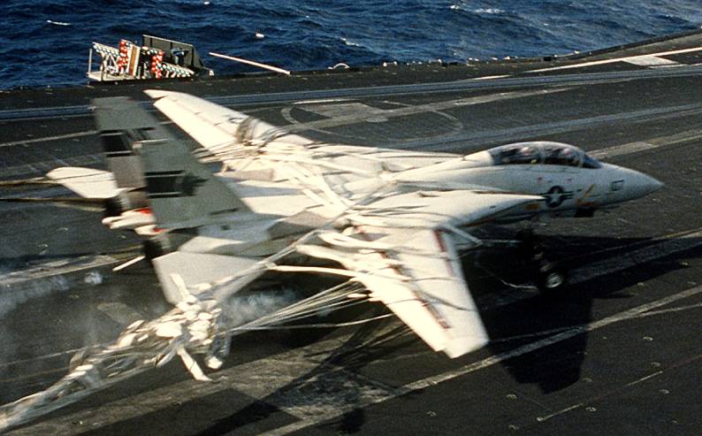 Photo Sequence shows F-14A Tomcat Engaging Barricade during Emergency Landing aboard USS Kitty Hawk