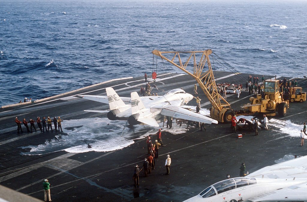 Photo Sequence shows F-14A Tomcat Engaging Barricade during Emergency Landing aboard USS Kitty Hawk