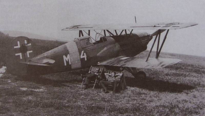 During WWII a Slovak Air Force’s biplane pilot rescued a downed fellow pilot by carrying him on the bottom wing of his aircraft