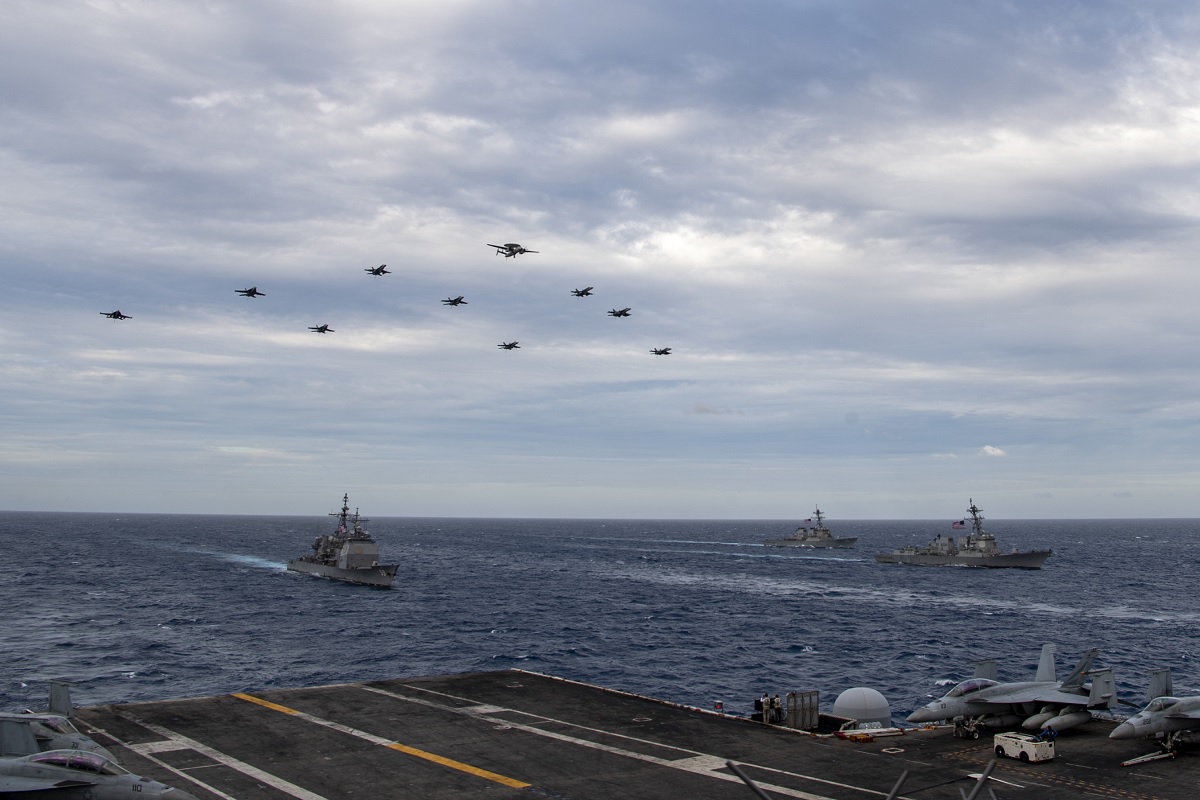 Two weeks after Chinese Combat aircraft conducted a mock attack on USS Theodore Roosevelt, the flattop conducts dual carrier operations with USS Nimitz in the South China Sea