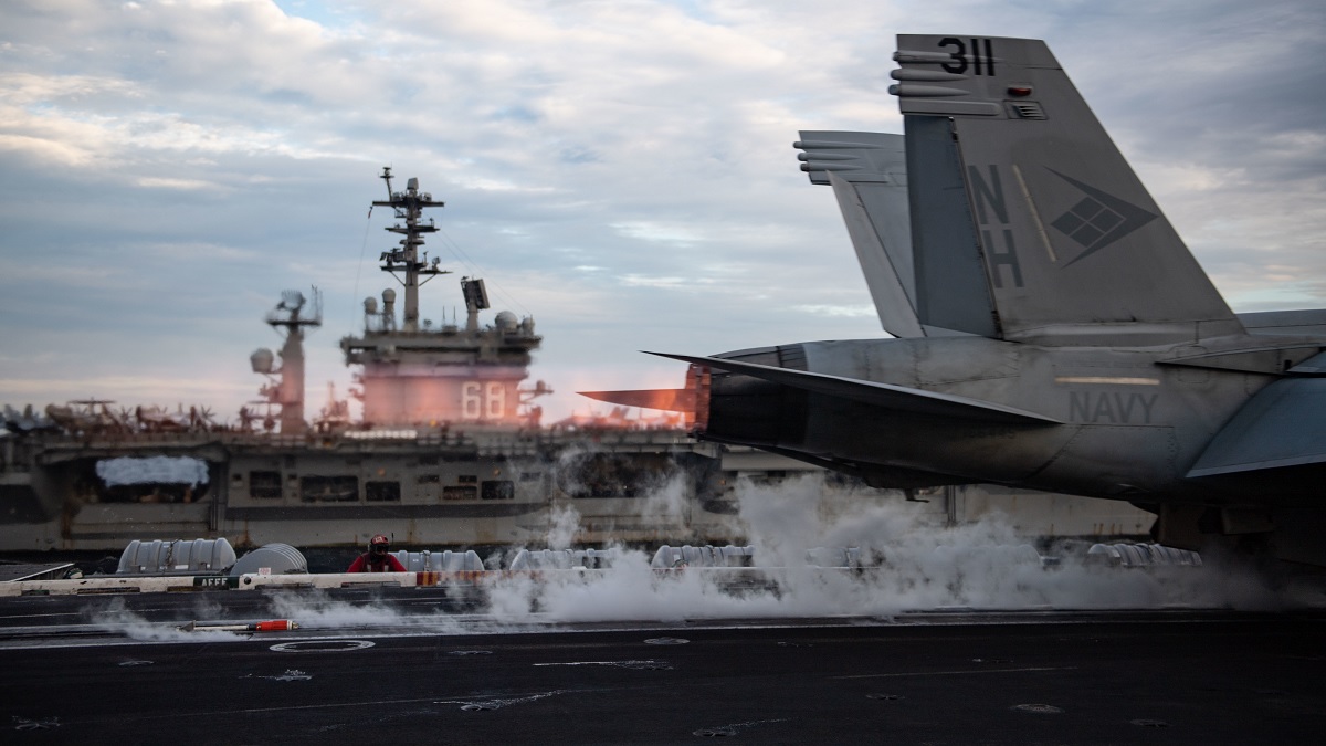 Two weeks after Chinese Combat aircraft conducted a mock attack on USS Theodore Roosevelt, the flattop conducts dual carrier operations with USS Nimitz in the South China Sea