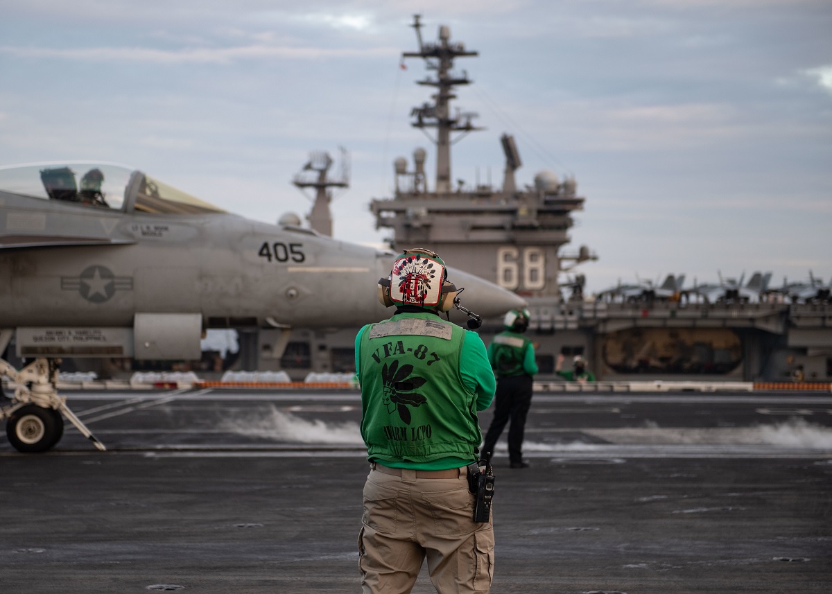 Two weeks after Chinese Combat aircraft conducted a mock attack on USS Theodore Roosevelt, the flattop conducts dual carrier operations with USS Nimitz in the South China Sea