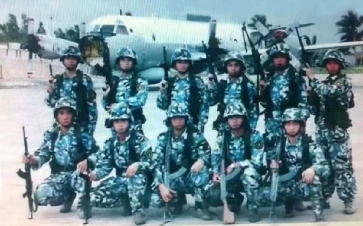 Chinese Marine Corps releases photo of a group of marines in front of a dismantled US Navy EP-3 Aries II on 20th anniversary of the Hainan Incident