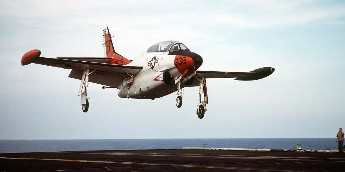 US Navy T-2 Instructor Pilot recalls when he had a bird strike while towing the banner for aerial gunnery training flight